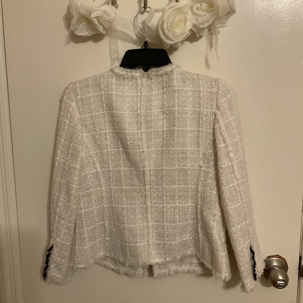 White textured blazer with silver button detail.